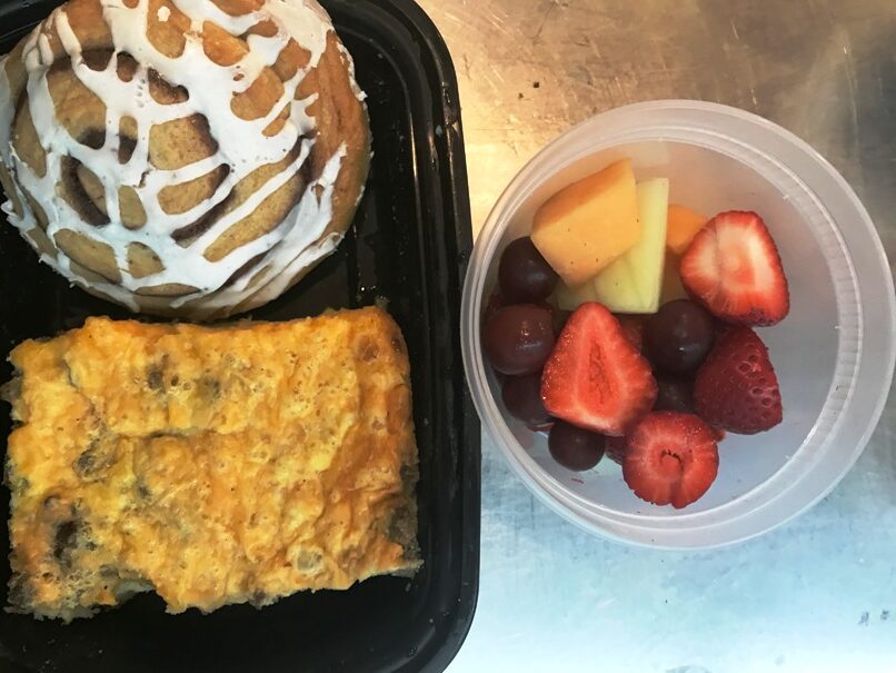 Breakfast casserole square, pastry and fruit